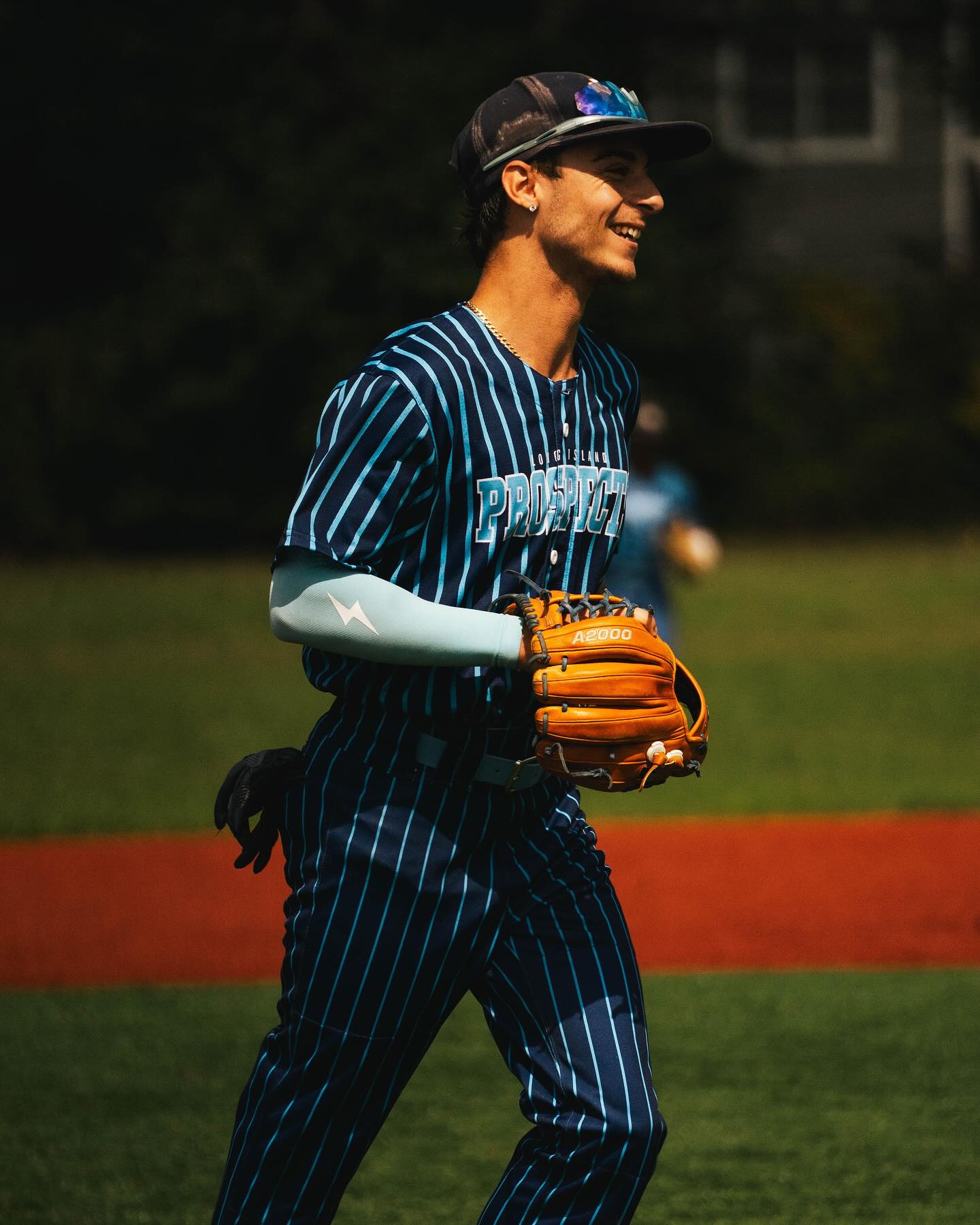 Jordan Licausi pitching for his college baseball team